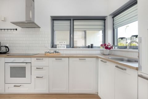 This comfortable semi-detached holiday home is located in a quiet part of the beautiful resort town of Trzęsacz. The seaside beach is 500 meters away. Trzęsacz boasts several interesting restaurants and a few shops offering a full range of goods. A b...