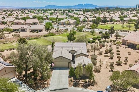 RARE OPPORTUNITY! Stunning home on one of the largest cul-de-sac lots in Sun City Aliante with 156’ of golf course frontage—no stray balls, just golf and mountain views from this premier elevated 1/4-acre lot. Detached 280 sq ft casita with full bath...