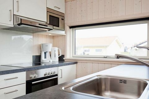 Danish quality holiday home located in a beautifully landscaped dune landscape in the holiday park Holiday Vital Resort Großenbrode. The house is bright and practical with a combined kitchen / living room and living room with direct access to the par...