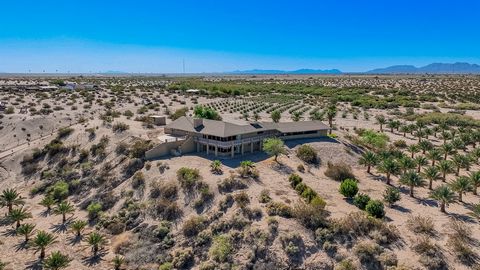 Perched on a ridge overlooking the Gila River Valley is an amazing opportunity. Not only can you live in a luxurious home and setting the land can produce a living for you and your family. This farm just north of I-8 has 20 acres (1,000+ palms) of Me...