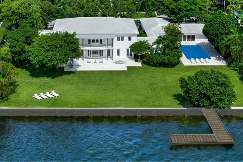 Step Inside With Me! A grand Bay Point estate originally built for a Miami industry pioneer. Situated on 36,000sf of grounds, this neoclassical residence opens to a timeless receiving area with dual marble staircases. Completely renovated in 2023, co...
