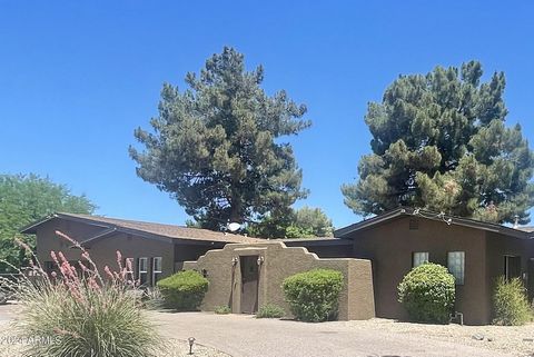 Experience the best of Arizona living on this nearly one-acre lot in Sunburst Farms East. This beautifully remodeled home features upgrades throughout, including a spa-like primary bathroom with a deep soaking tub and rain shower. Primary suite now i...
