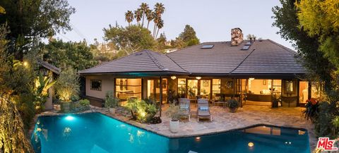 Property is owner occupied. Owner works from home. Showing requests are most easily confirmed on Friday's after 10:00 AM. Nestled in a highly sought-after Los Feliz enclave, this single-story mid-century home is a beautifully appointed luxury retreat...