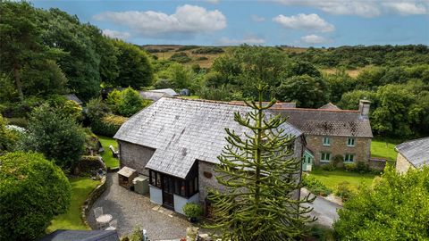 Higher Barn nestles in an idyllic location in the tree-lined Fuchsia Valley and is set in a tucked away location in its own delightful gardens and grounds offering a great deal of seclusion. The property is packed full of character and charm and is i...