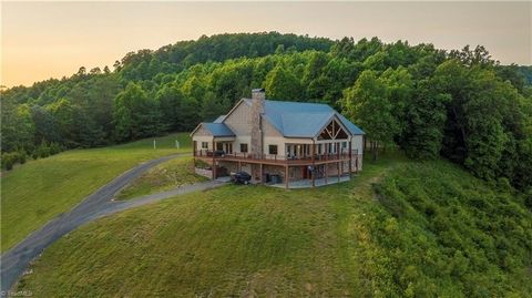 A dream location & dream home that sits amongst the clouds, with breathtaking 240 degree views that stretch 50 miles & span 2 states, where you can see the skyline of Winston-Salem, watch thunderstorms over Raleigh, peek at Grandfather Mtn, marvel at...