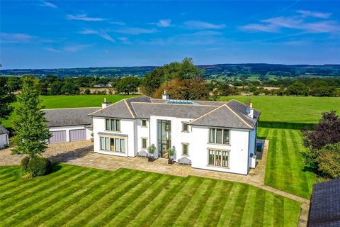 This stunning, architecturally designed home was masterfully constructed in 2006 by the acclaimed builder David Holmes, blending the timeless charm of the Arts and Crafts movement with a contemporary twist. Set on a gated plot of just under an acre, ...