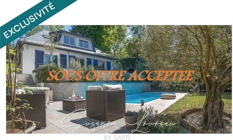 Maison familiale avec terrasses et piscine entourée de verdure