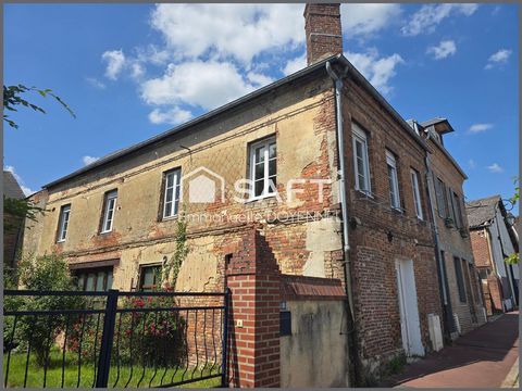 Maison de ville au style loft à Orbec – Charme et potentiel à révéler