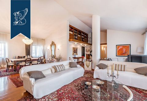 This luxurious sea-front penthouse is for sale in the renowned seaside town of Viareggio, on the Tuscan sea. A bright and spacious entrance hall leads us into an elegant living area, and is connected through a modern glass staircase to a comfortable ...