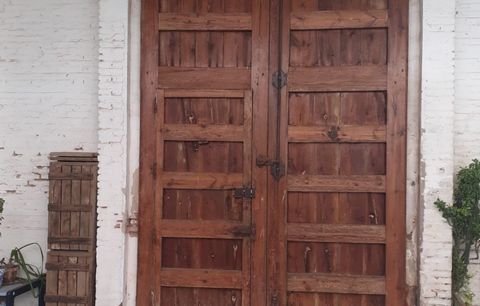 Did you ever pass a beautiful double wooden door like this in a Spanish street and wonder what's behind it? Well if the property hasn't been gutted and 'modernised', there will be a beautiful sunny courtyard will terraces above looking down.. . This ...