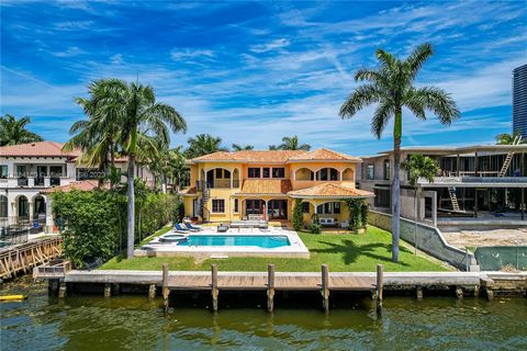Stunning 5BR, 6.5BA waterfront home situated on Golden Beach's most desirable and widest waterway. Enjoy breathtaking sunsets from this home's beautiful pool and outdoor dining area, with over 80ft of direct water frontage and 14,000 SF of land on Go...