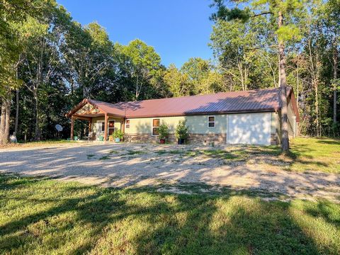 The Honey Bee Homestead encompasses just over 10 surveyed acres and is highlighted by the incredibly well built 1,344 square foot home that was completed in late 2023. The property has a mixture of open ground and timber, has a pond, and sits less th...