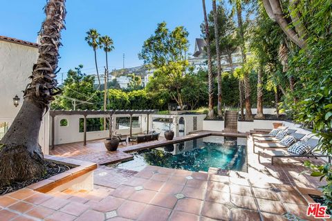 Major price improvement! Situated on a huge 12,168sqft double lot with an extra flat pad. Welcome to your Hollywood Hills haven, perched majestically just above the iconic Sunset Strip. This exquisite property, reminiscent of the enchanting Spanish M...