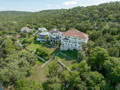 Experience unparalleled luxury and breathtaking natural beauty in this stunning waterfront (when levels are full) home on Long Hollow Creek Cove overlooking Lake Travis. Nestled on nearly an acre in the coveted Cypress Acres, this exceptional propert...