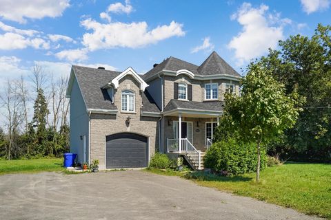 Sumptuous two-story residence, nestled on a vast 30,000 square foot lot, just 10 minutes from Saint-Eustache (via Highway 640) and 15 minutes from Laval (via Highway 13). The kitchen, completely renovated in 2023, features an elegant quartz counterto...