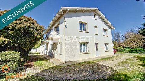 Maison T9 270m² avec garage, dépendance et parc arboré.
