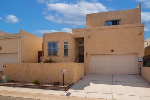 Bright and inviting 2-bedroom, 2-bathroom patio home in highly desirable NE Albuquerque. Featuring skylights, vaulted ceilings, and a cozy pellet stove. This home offers a low-maintenance yard and all appliances conveying. Over-sized garage provides ...