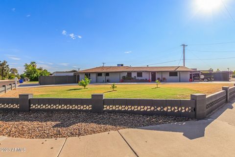 Explore this captivating corner-lot haven, an authentic Arizona treasure. The expansive front yard and welcoming porch beckon you inside. The foyer boasts wood-look vinyl flooring, setting a modern ambiance. Recessed lighting illuminates the living s...