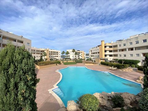 Modern and bright beachfront apartment with side views for sale Beautiful flat with elevator, two bedrooms, a bathroom, living room, kitchen and a terrace with side sea views Complex with large common areas and gardens, huge community pool and sun lo...