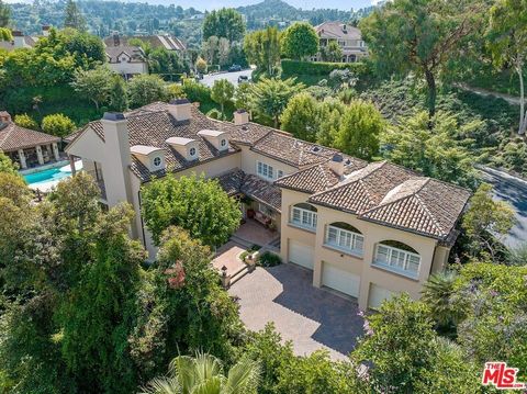 Experience the epitome of luxury where the charm of the South of France meets the grandeur of Southern California in this 5-bedroom, 8-bathroom masterpiece. Nestled in the exclusive Royal Oaks area of Encino, this custom-built family home is just mom...