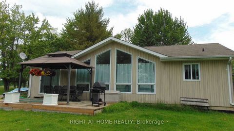Updated 4 Seasons Waterfront Home. 3 Bedroom Waterfront Bungalow On Lake St John. Open Concept Design, Laminate Flooring And Plenty Of Natural Light. Kitchen Complete With New Granite Center Island, Loads Of Counter Space And Overlooks Water. Living/...