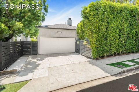 Gated and hedged contemporary 3 bedroom and 3 bath home situated in the coveted 