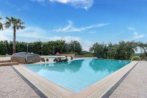 Tranquil Retreat with Pool, Sauna & Garden Views Escape to the sun-soaked countryside of Eastern Sicily and unwind in this charming holiday home for two. Tucked away in Carlentini’s lush landscape, this air-conditioned retreat blends modern comfort w...