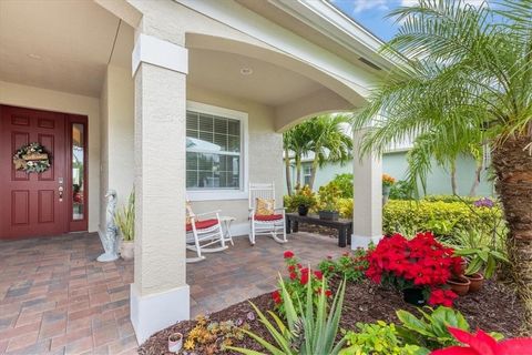 A GEM! IMPECCABLY LANDSCAPED! STUNNING 3-Bdrm 2.5-Bath LAKE VIEW LUXURY MODEL HOME w/Tile Roof & TILE FLRS THRUOUT. EXQUISITE FINISHES-Volume Tray Ceilings, Coffered Ceiling in Living Rm, Sconces, Recessed Lighting, & Elegant Chandeliers. Tall Slider...