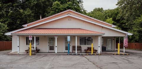Commercial opportunity in the lower Catskills! In the heart of Wawarsing on Route 209 and only 75 minutes from NYC, sits a 3000 sq ft mixed-use space on a well-maintained half acre of land, brimming with endless potential. Once home to the Hudson Val...