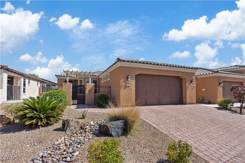 55+ resort-style living at its finest in the prestigious, gated Ardiente community of North Las Vegas. This beautifully upgraded home offers the perfect blend of indoor comfort & outdoor enjoyment with a private courtyard & spacious covered patio fea...