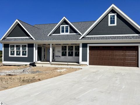 New custom home built Old Mission home by Rembrandt Construction is now complete! Gorgeous design and detail with high end finishes throughout. This is everything you see in a fabulous new home. The main floor includes a generous primary suite, laund...