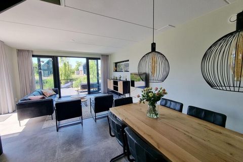This luxurious detached water villa is an ideal vacation spot for families or groups of 6 adults and 2 children. Located on a new small-scale villa park, the villa boasts a direct connection to the Slotermeer, allowing guests to rent a boat and explo...