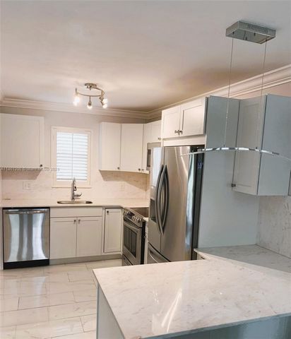 Incredible opportunity! This exquisite 2-bedroom, 2-bathroom condominium is located in the heart of downtown Boynton Beach, within an exclusive gated coastal community. With its open and contemporary kitchen concept, stainless steel appliances, and q...