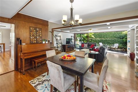 Special features abound at this extremely private, estate-sized property on over 19,000 sf in the leafy, green Manoa-Woodlawn neighborhood. A long, curving driveway leads up to the porte-cochere, under which two cars can park side-by-side, then circl...