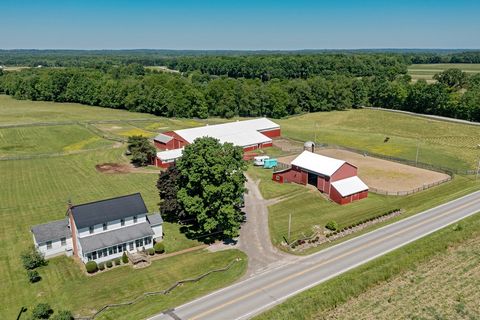 Welcome to this sprawling & picturesque 20+ acres horse farm in beautiful Geauga County! The entire property includes a 23-stall horse barn with an indoor riding arena, a two-story hay barn with 8 additional stalls, and a charming century home with a...