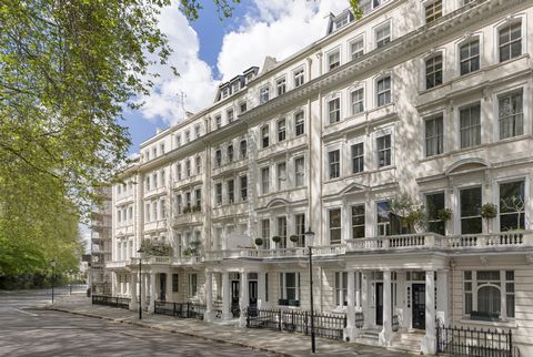 This is a south-facing luxury property with high ceilings in a beautifully maintained, stucco-fronted Victorian-era building. Situated on the first floor, the apartment has ornate period features and elegant wooden flooring. The interior features a l...
