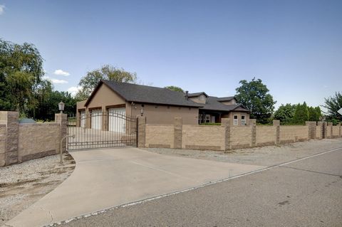 Gorgeous, single-level, one-owner Northern NM -style home on a fully fenced 1.25 acre in the beautiful Tierra Verde subdivision just west of the Rio Grande bosque. The custom-built home features a large primary suite with spacious bath & huge walk-in...