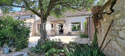 Maison de ville en pierre, 142 m², 5 piéces avec jardin, garage et cave.