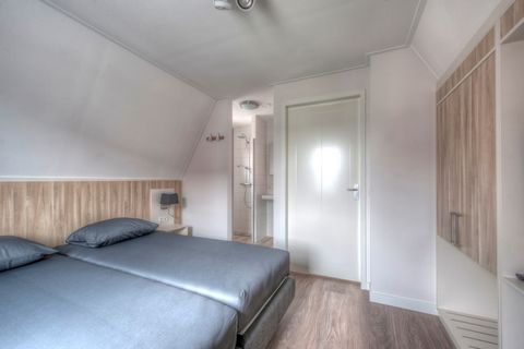 Step into a charming blend of 1930s elegance and modern comfort in this beautifully designed 4-person villa at Noordzee Résidence Dishoek. Nestled in an intimate, small-scale resort, this luxury retreat offers a peaceful coastal escape. Inside, the v...
