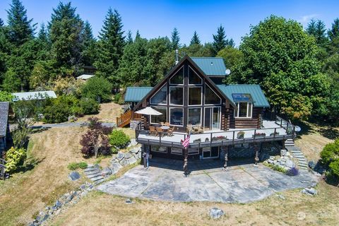 On the grid or off, your choice. Twelve outstanding deer-fenced acres, 1.16 mi from town center, with a custom 3080 sf home utilizing wood burls from Alaska, 675 sf log guesthouse with vacation rental permit, both overlooking the lake, 600 sf studio ...