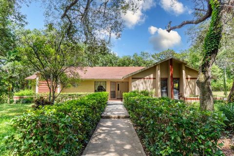 Nestled on 5 ACRES of stunning mature landscaping, this custom-built home is a mere 15 minutes from Disney and 5 minutes from the Hamlin Town Center, local shops, and dining. Surrounded by majestic southern oaks and flowering bushes, this property sh...