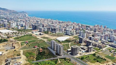 Immobilier Neuf Avec Vue sur Mer Près de la Plage à Alanya Mahmutlar Les nouveaux biens immobiliers sont situés à Mahmutlar, l'une des zones les plus prisées pour les vacances et l'investissement avec ses hôtels, restaurants, cafés, parcs, jardins et...